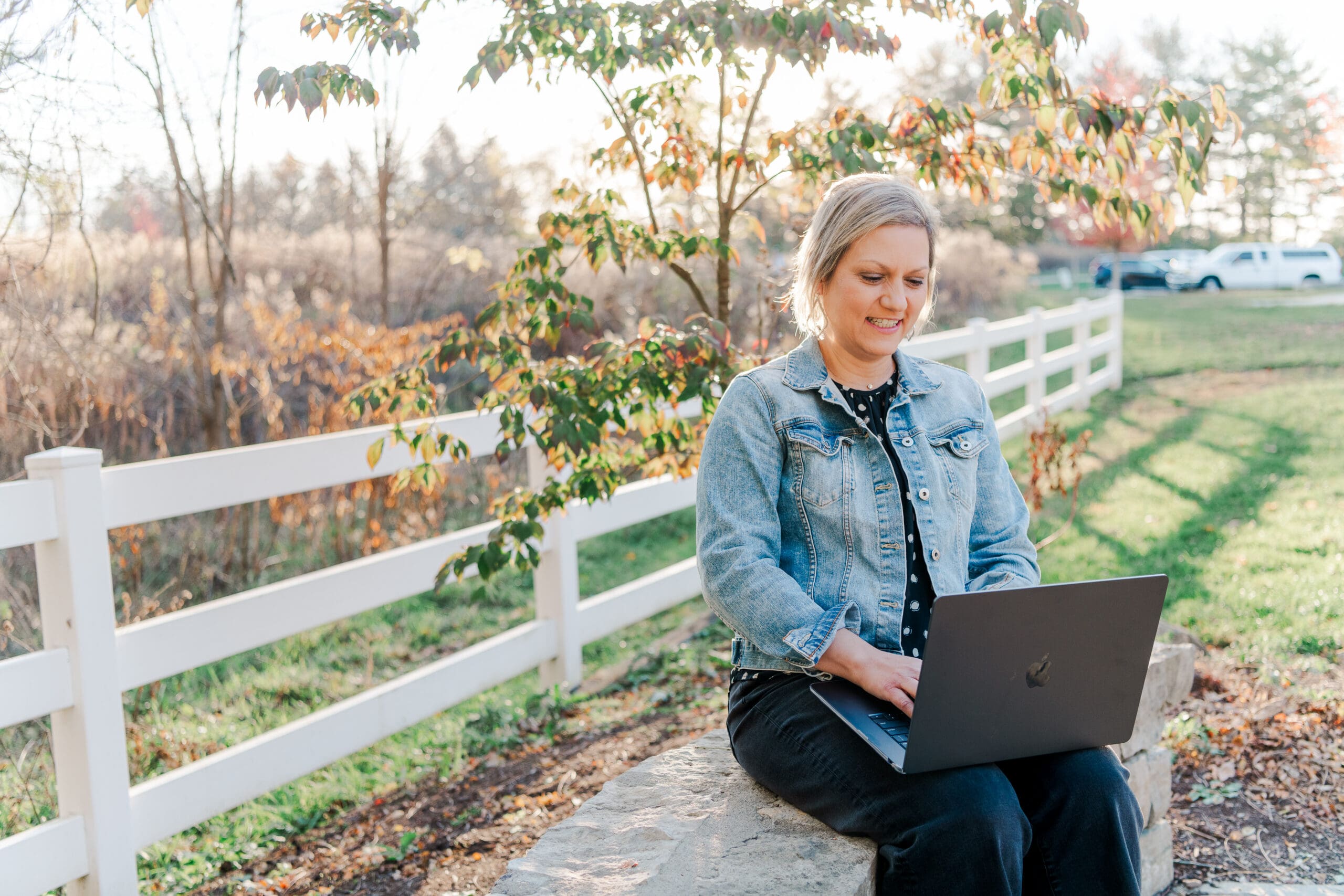woman working on laptop at bill yeck park