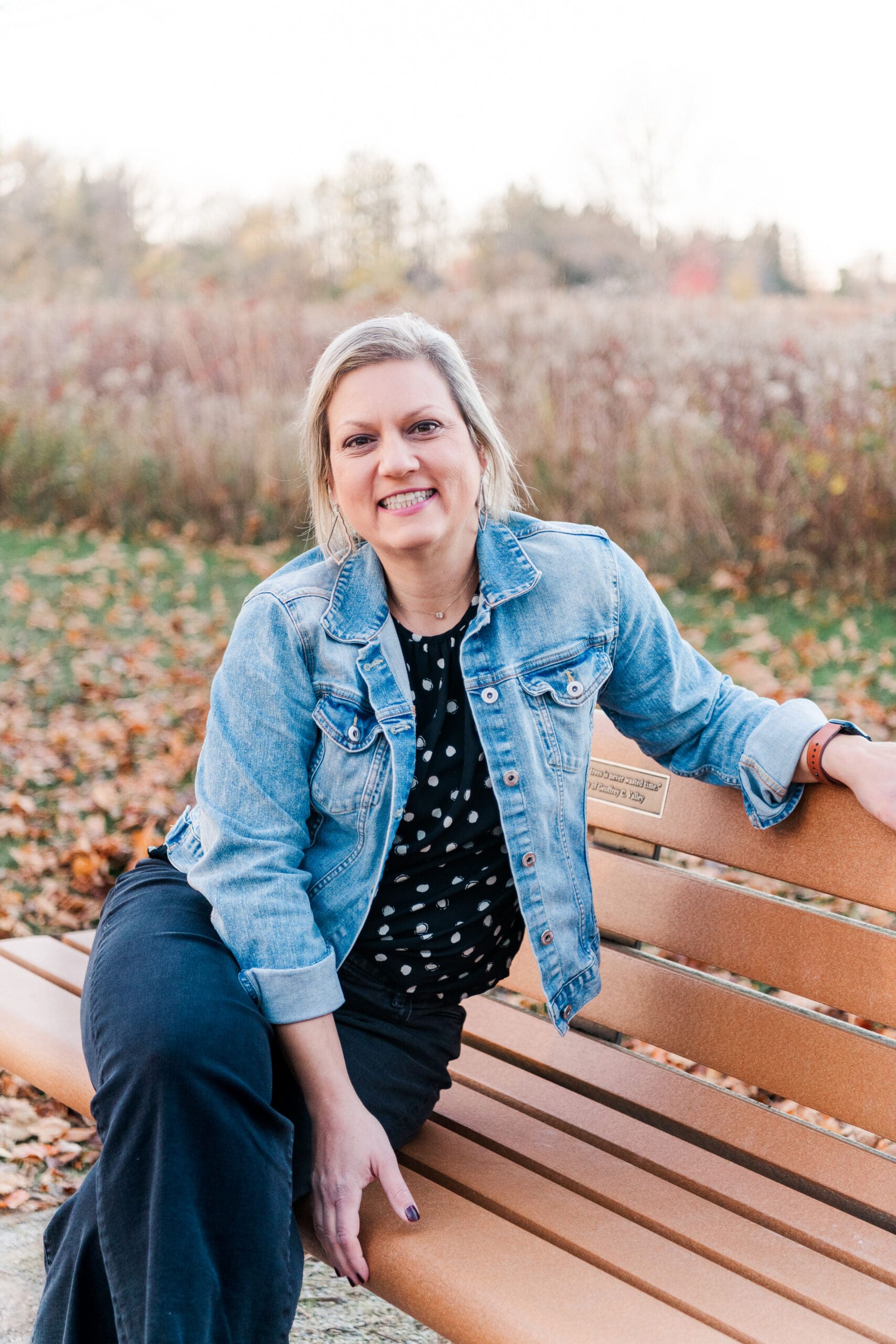 woman sitting on bench smiling in centerville oh