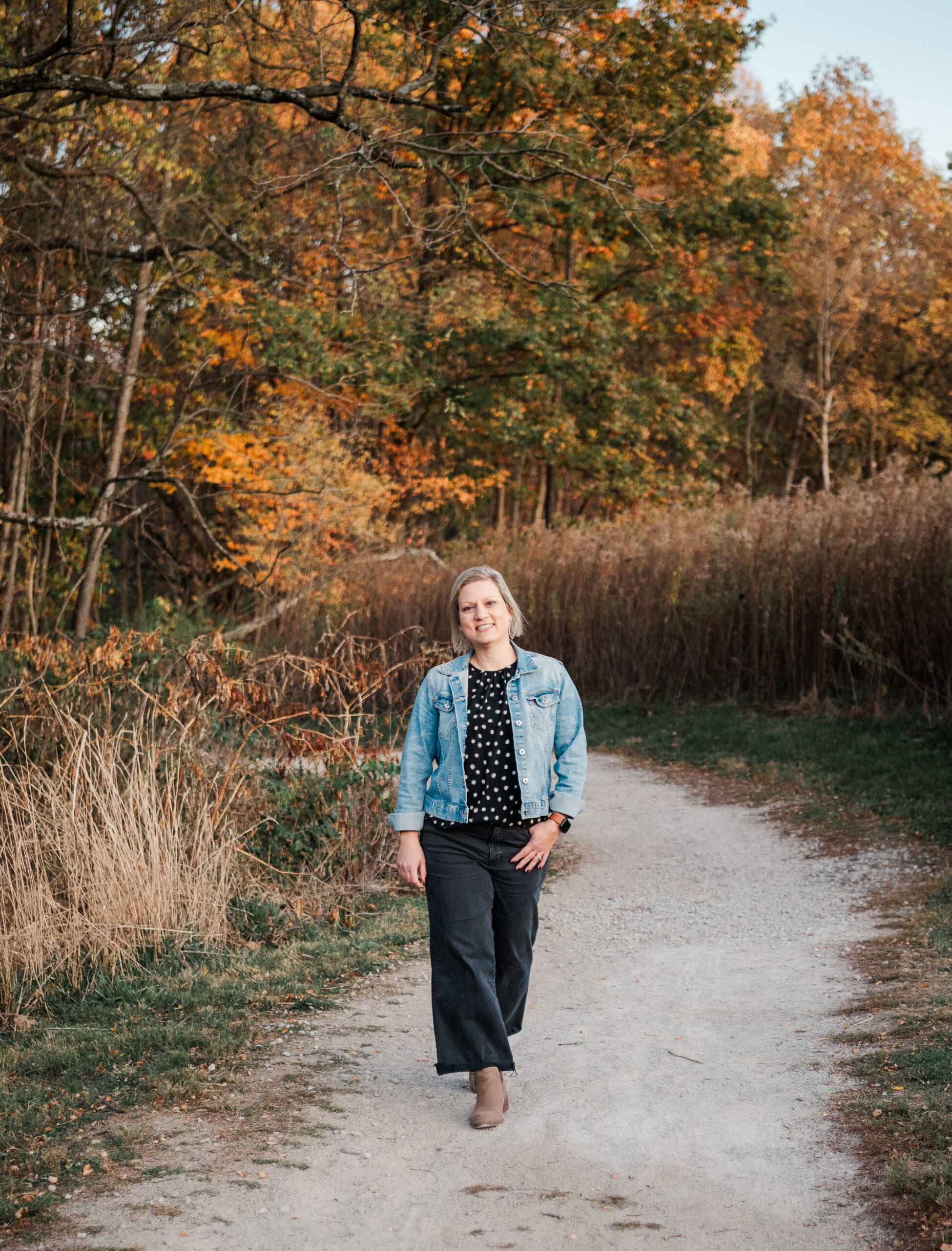woman-walking-down-fall-lane-bill-yeck-park